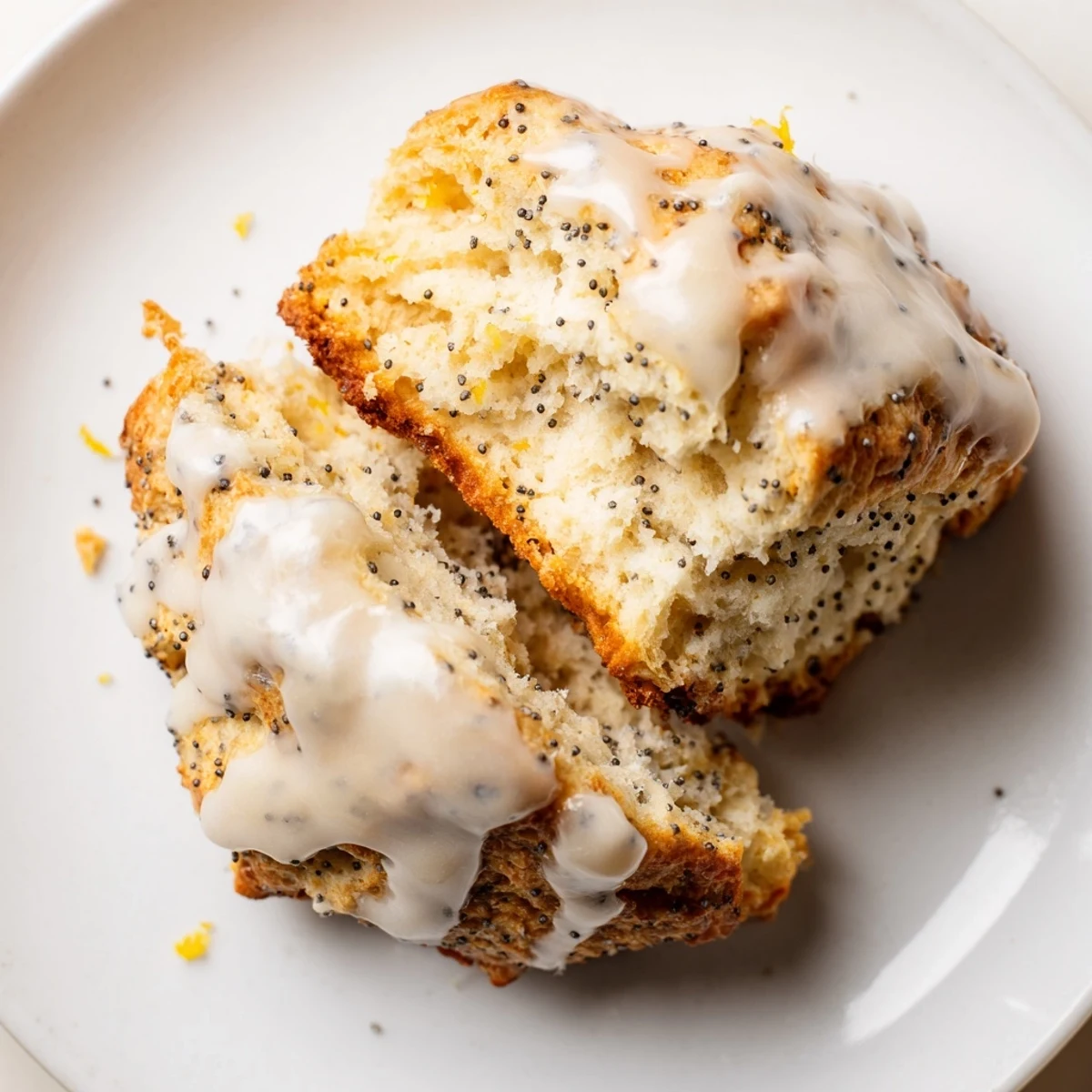 Warm Lemon Poppy Seed Scones on a rustic platter, featuring zesty lemon zest and crunchy poppy seeds in every bite.
