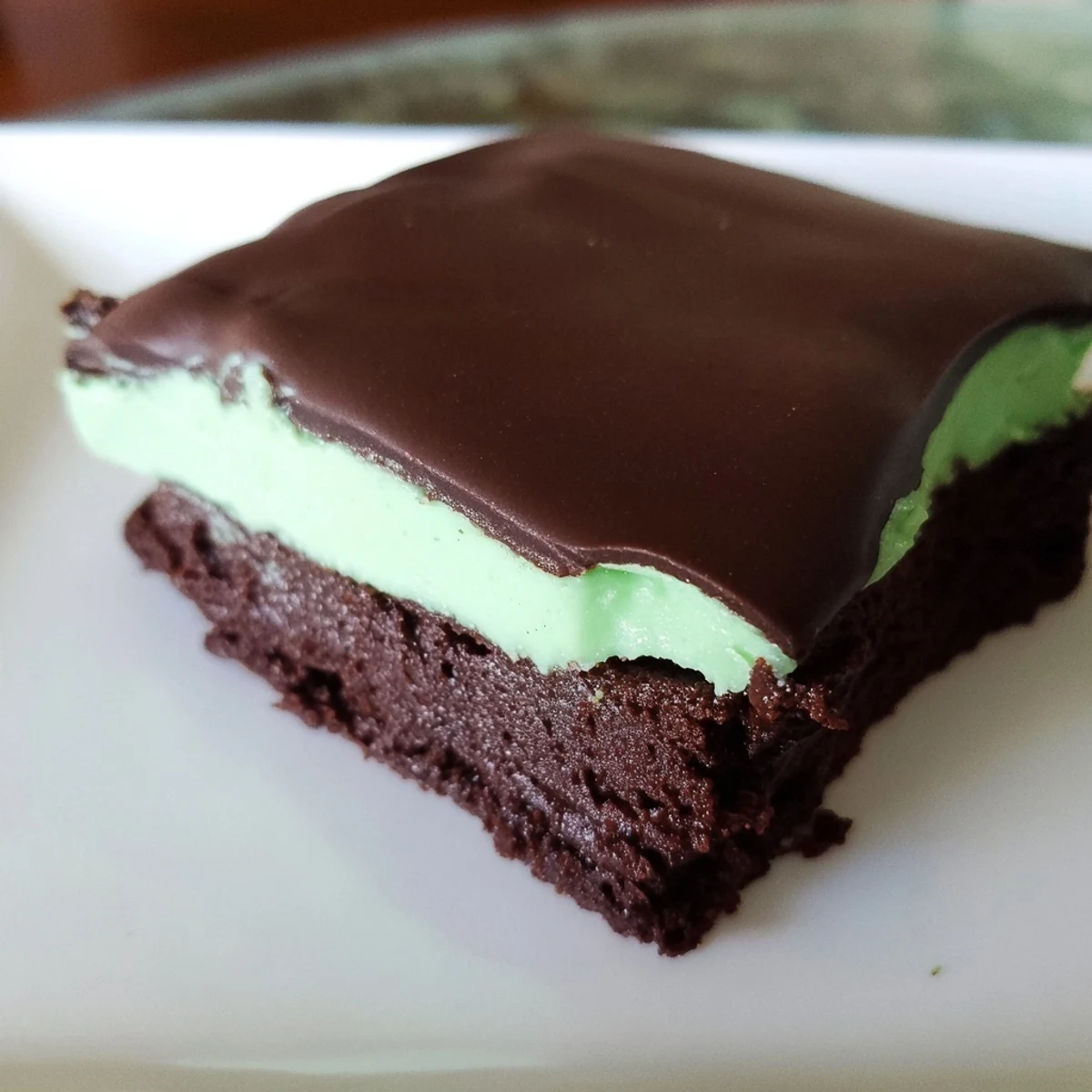 Glossy chocolate ganache tops a layer of Shamrock Mint Brownies with Chocolate Ganache.