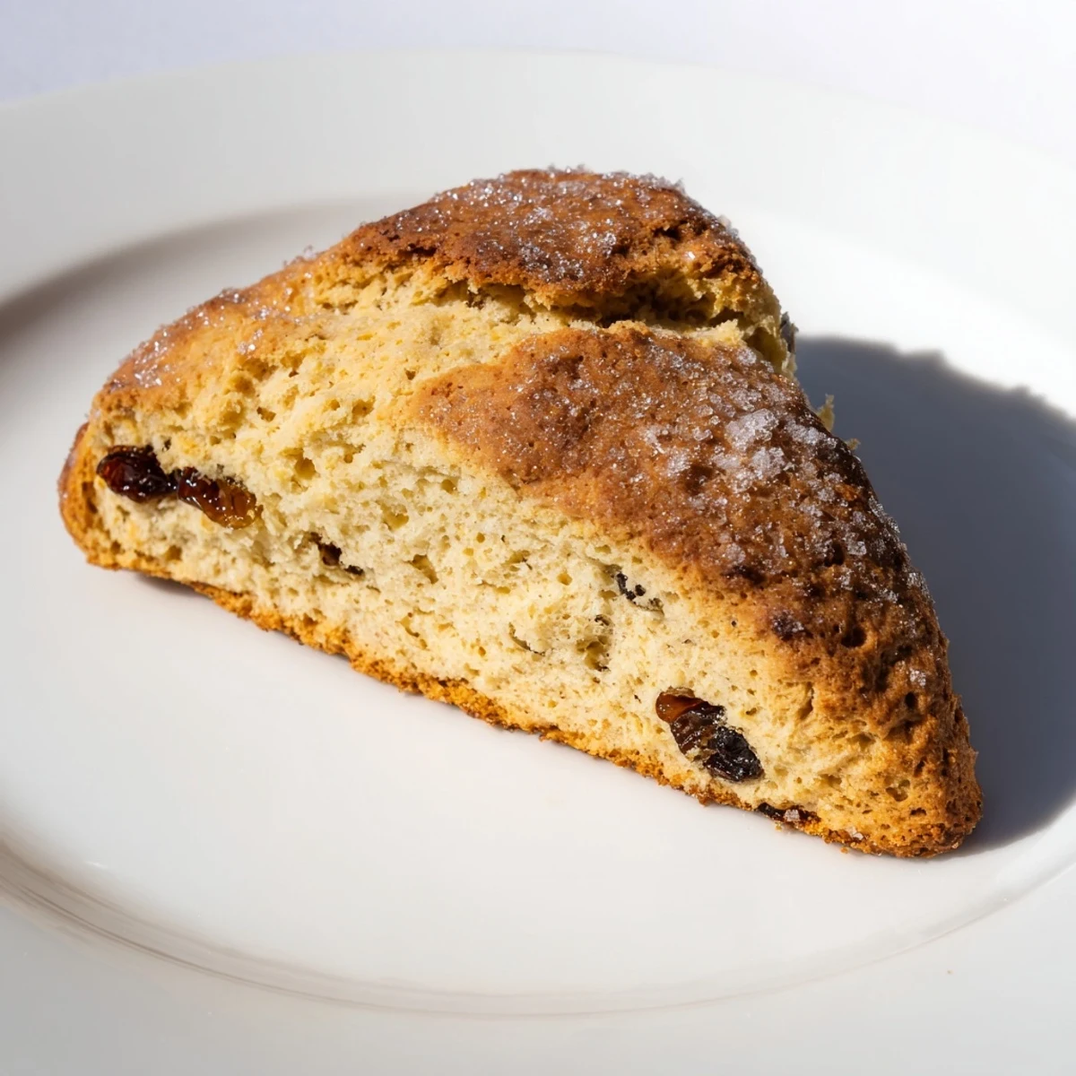 A batch of eight golden Irish Soda Bread Scones on a parchment-lined baking sheet, ready to be enjoyed for breakfast or afternoon tea.