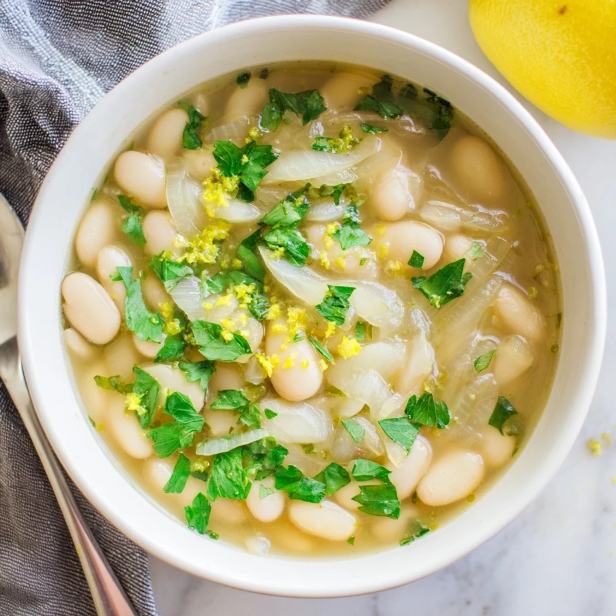 Creamy Miso Butter Brothy Beans simmered in a rich broth, served with crusty bread