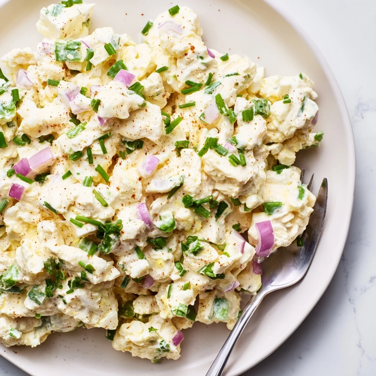 Wholesome cottage cheese egg salad with chopped hard-boiled eggs and fresh parsley for a light lunch.