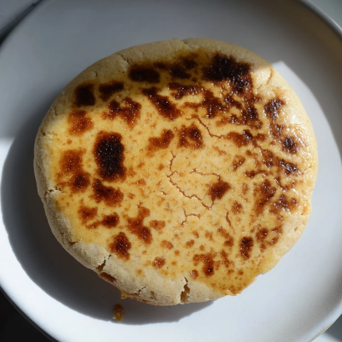 Golden crème brûlée cookies with caramelized sugar tops and creamy vanilla centers