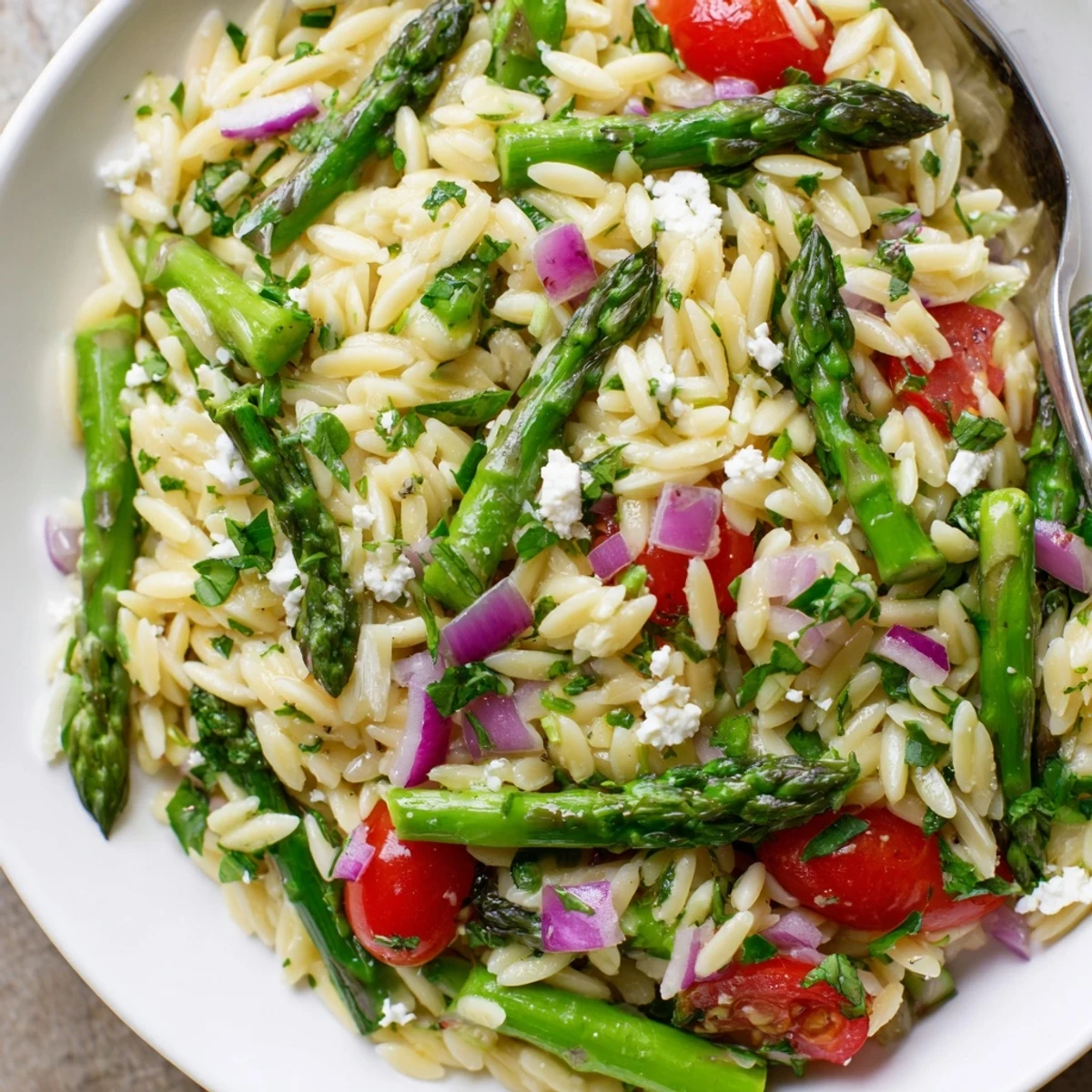 Asparagus Orzo Salad With Lemon Vinaigrette, bright green spears and crumbled feta