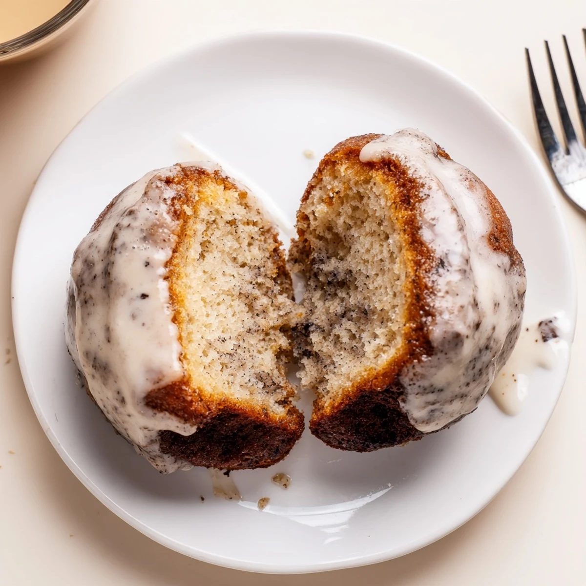 Banana Donuts glistening with vanilla glaze, golden edges and soft crumb