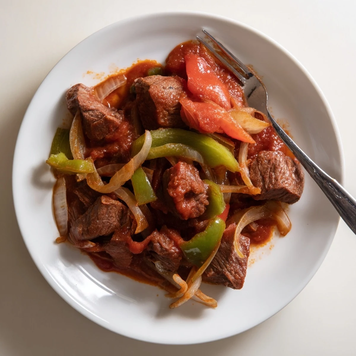 Golden seared old fashioned Swiss steak with beef nestled in vegetables