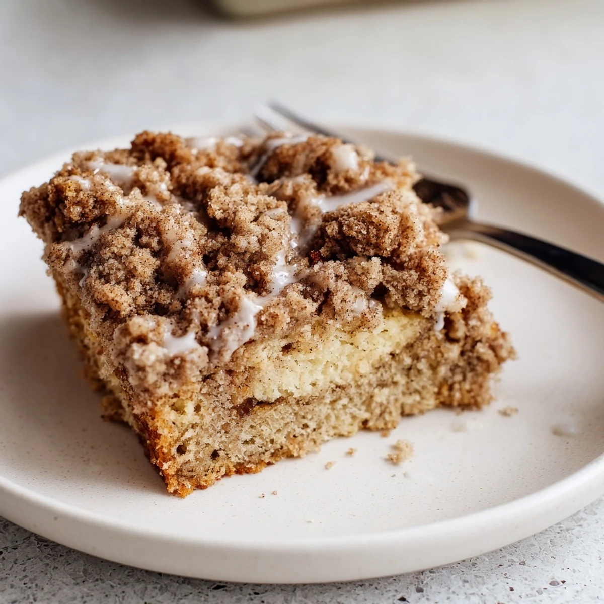 Banana Crumb Coffee Cake fresh from pan, buttery cinnamon crumb topping steaming.