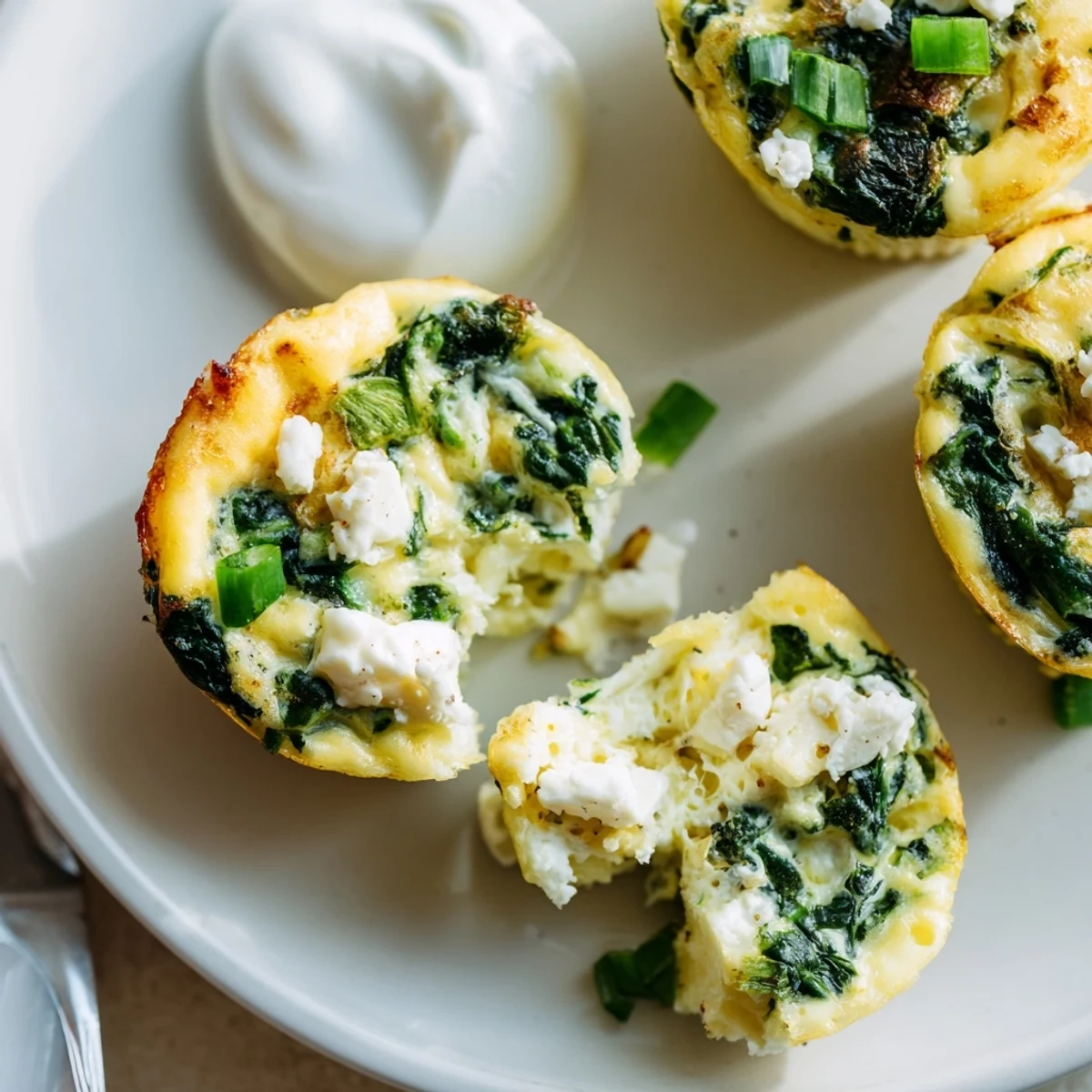 Meal-prep container with Savory Spinach Feta Egg Bites ready for weekday breakfasts