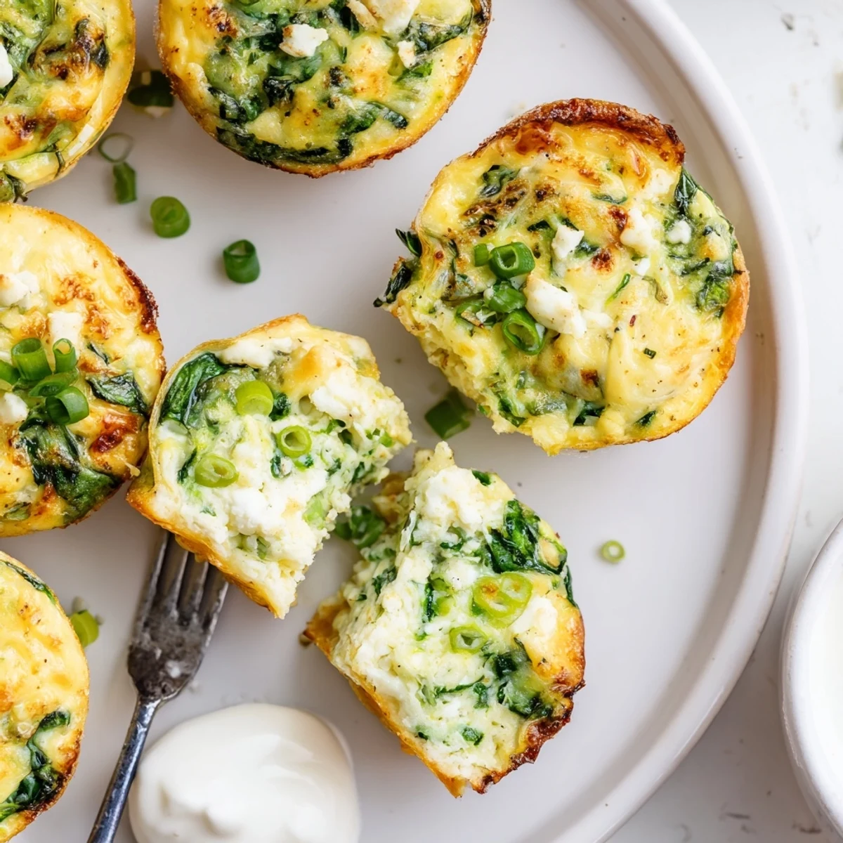 Close-up of Savory Spinach Feta Egg Bites showing golden tops, fluffy centers