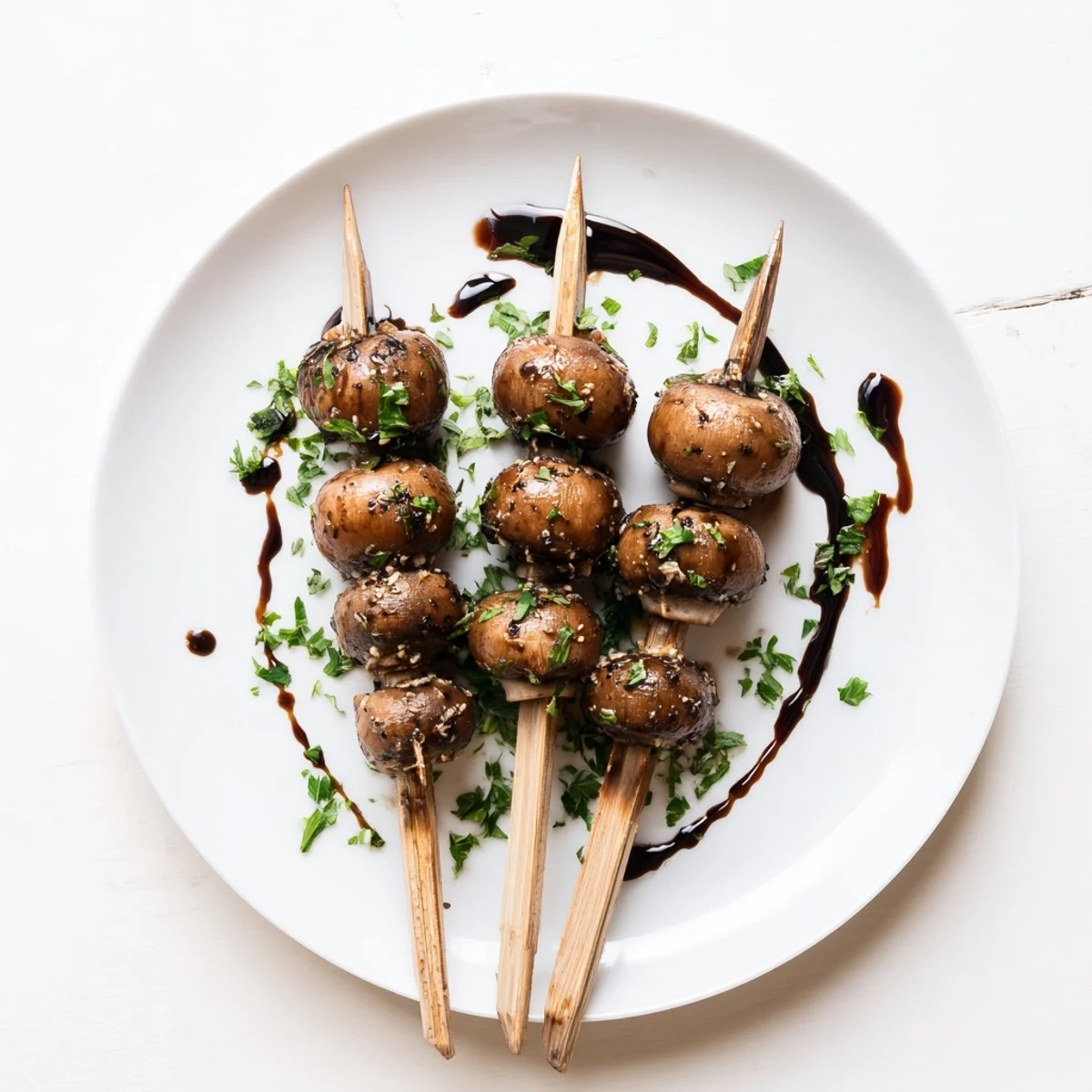 Balsamic Garlic Grilled Mushroom Skewers glistening with glaze, charred edges, parsley garnish.