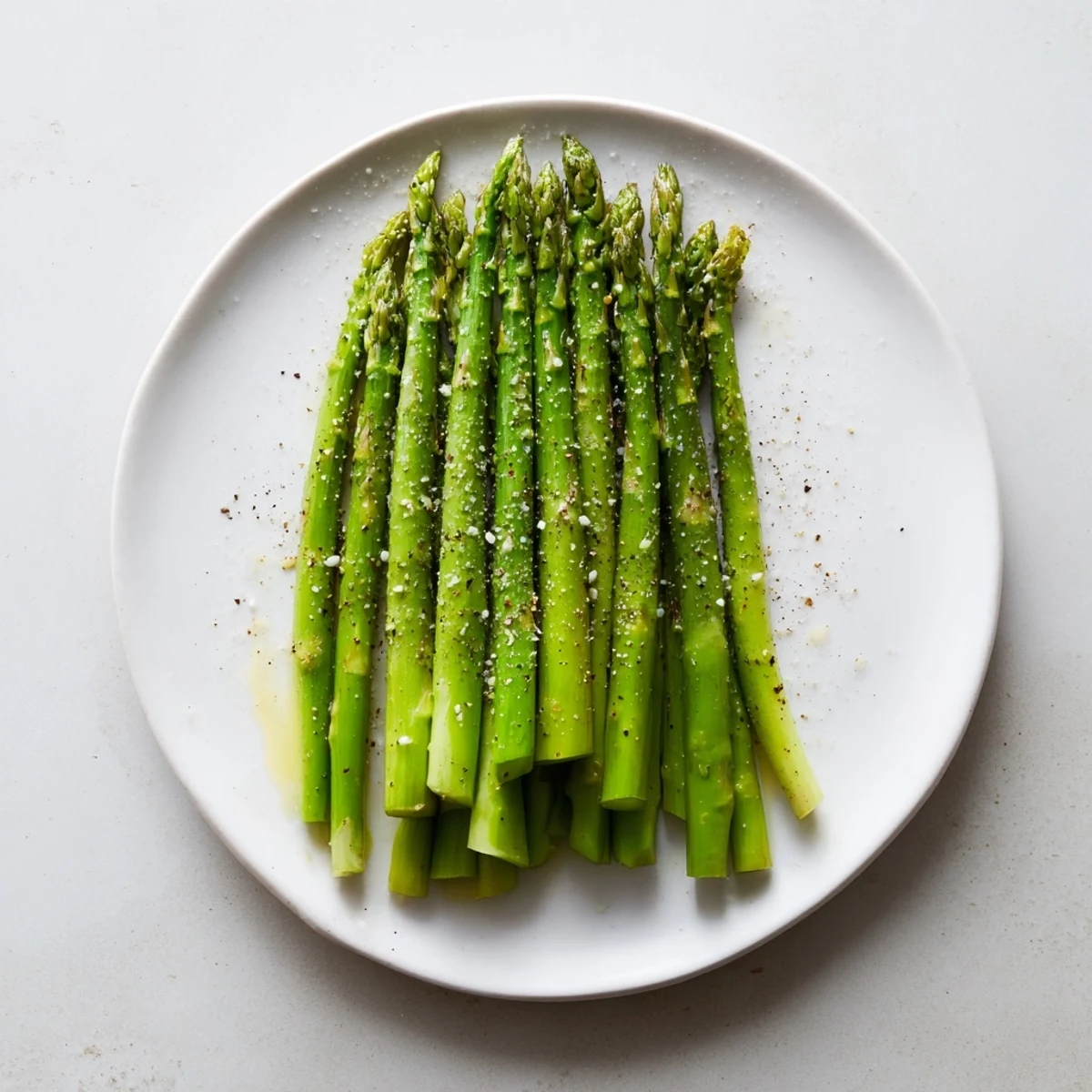 Spears of Steamed Asparagus seasoned with sea salt and olive oil