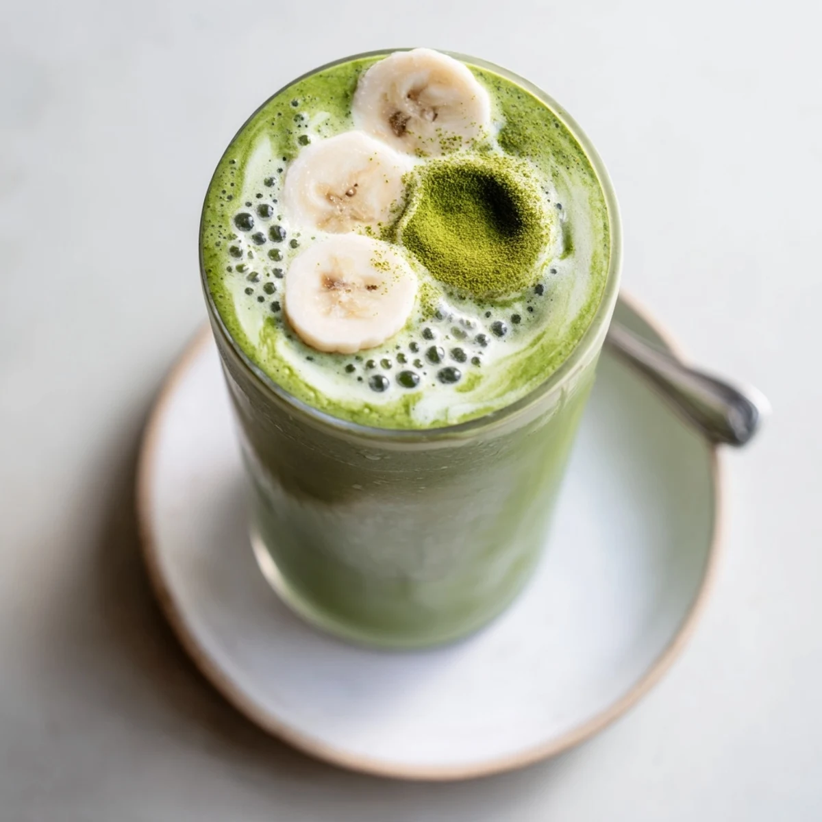 Creamy Matcha Smoothie with banana and almond milk, served with ice