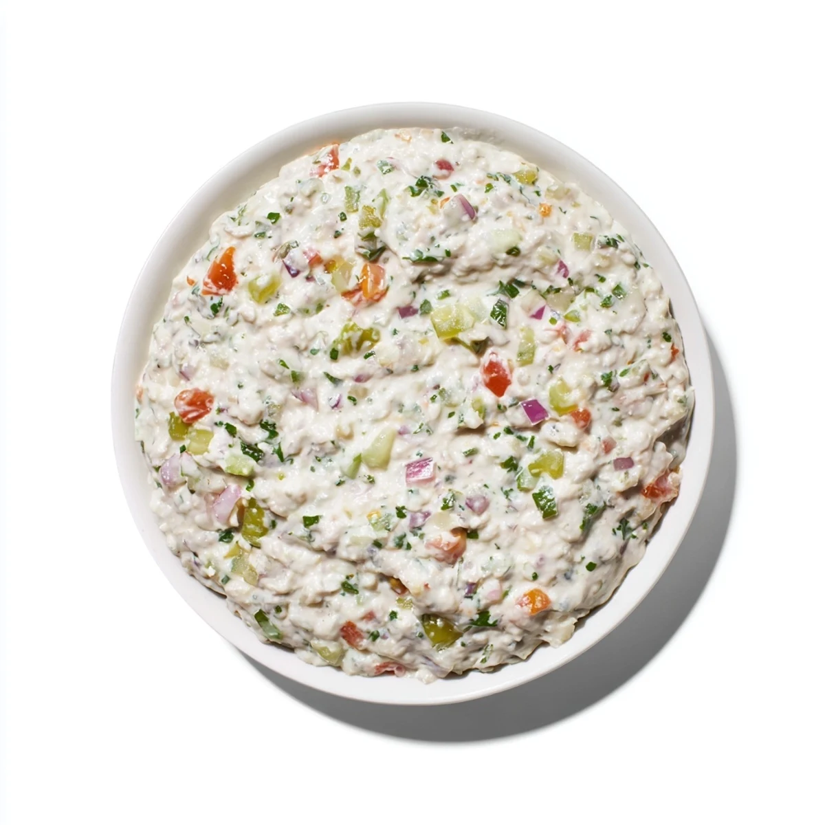 Creamy Grillos Pickle De Gallo Ranch Dip served in a white bowl with colorful red tomato chunks and green cilantro visible throughout the smooth white base