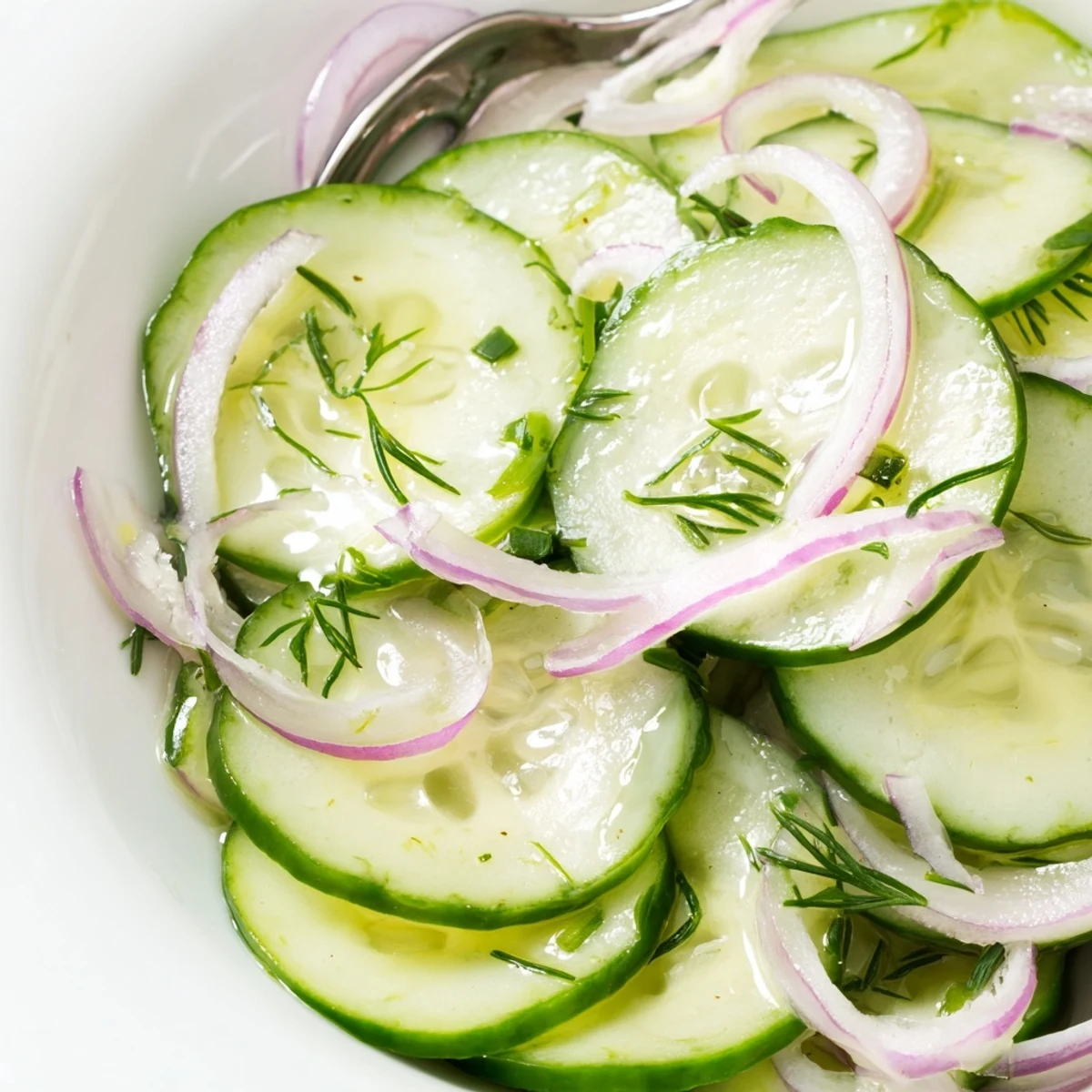 Tangy Cucumber Salad tossed in white wine vinegar, bright herb aroma