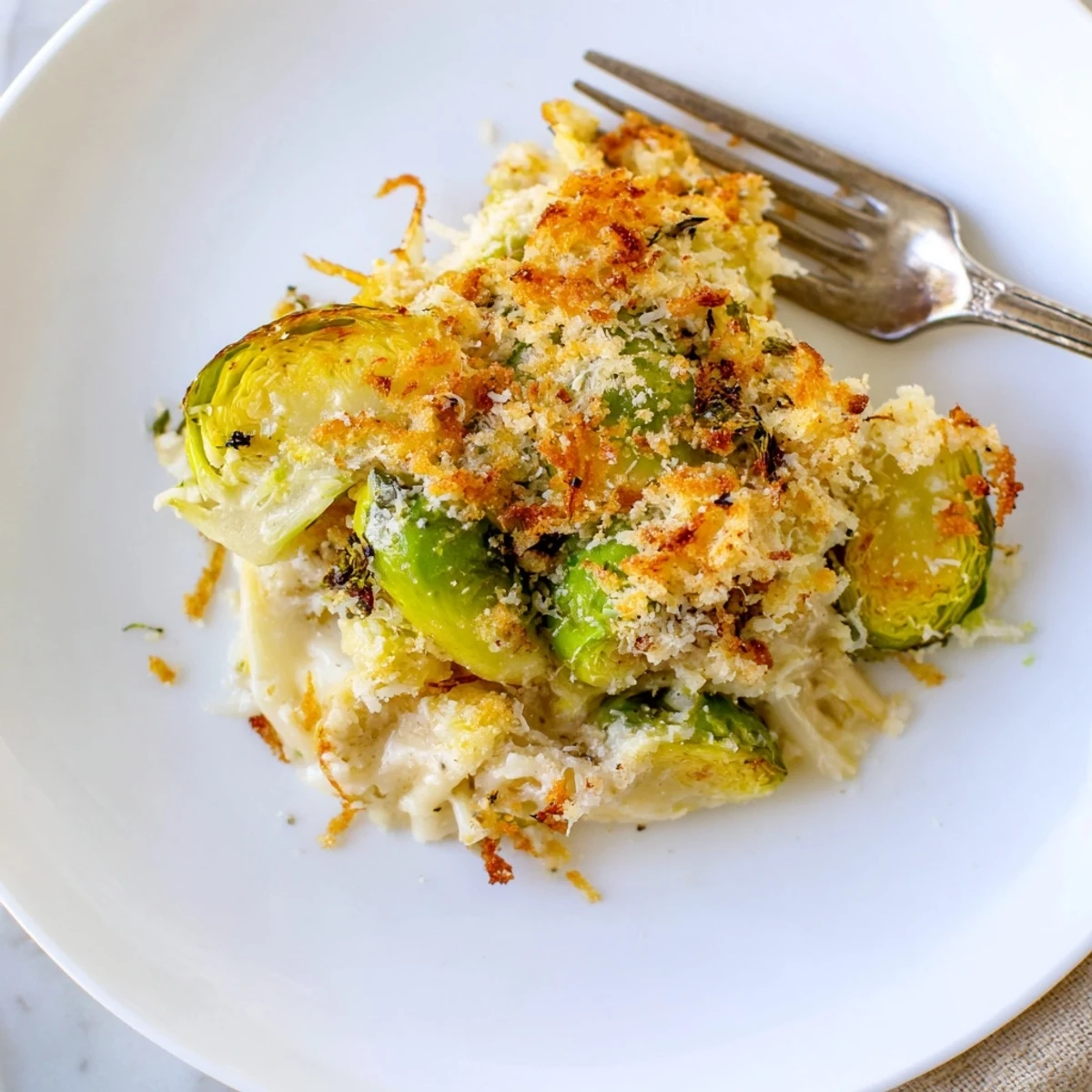 Oven-roasted Creamy Parmesan Brussels Sprouts Casserole with nutty Parmesan and panko topping.
