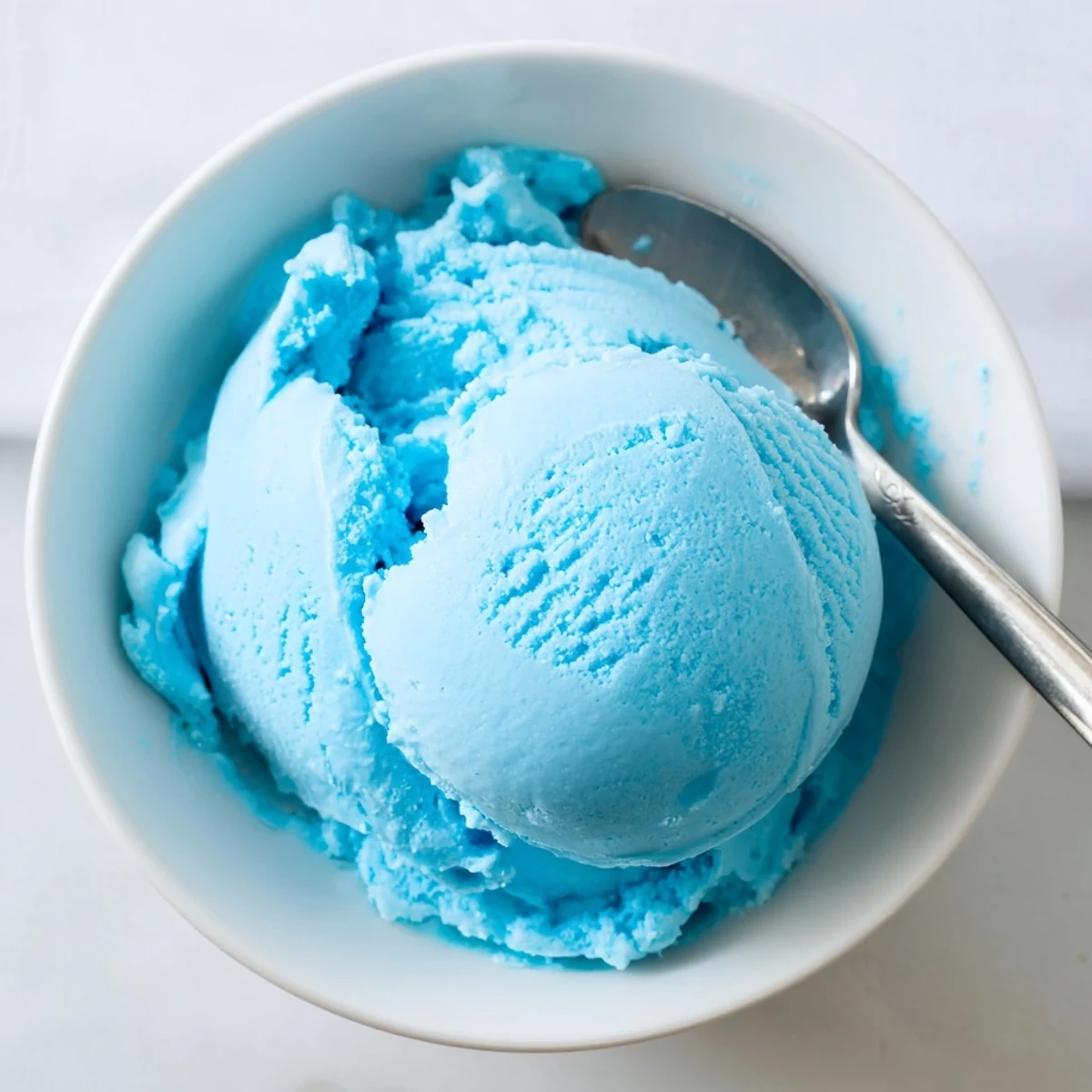 Vibrant blue Moon ice cream served in a bowl showing its smooth creamy texture