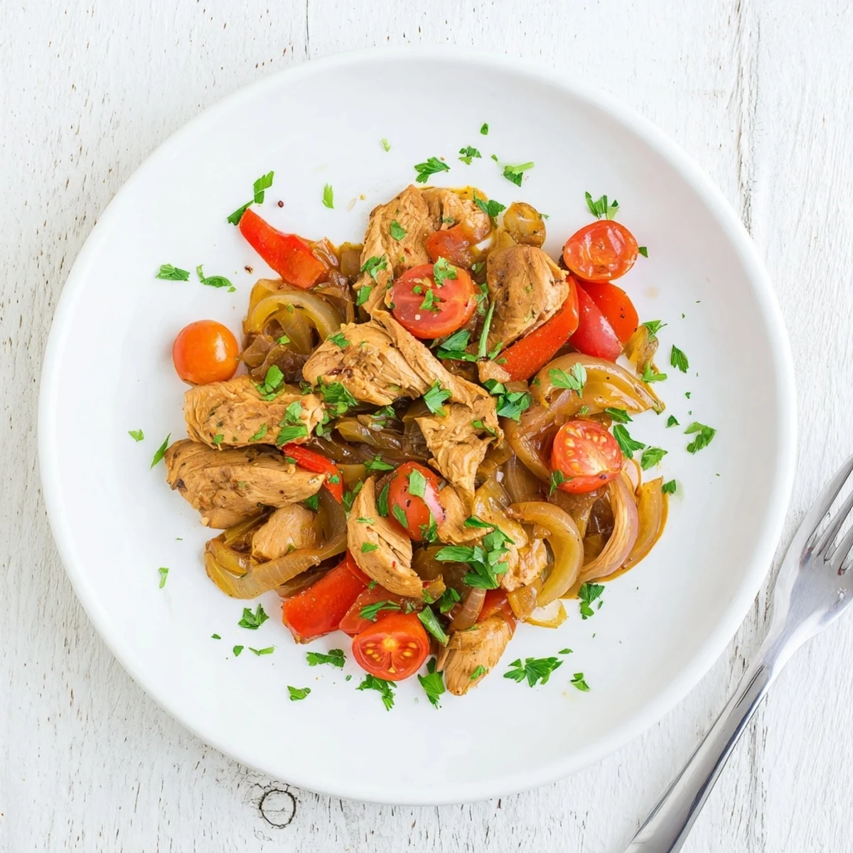Slow Cooker Balsamic Chicken simmering in a glossy, tangy sauce with colorful bell peppers and tomatoes