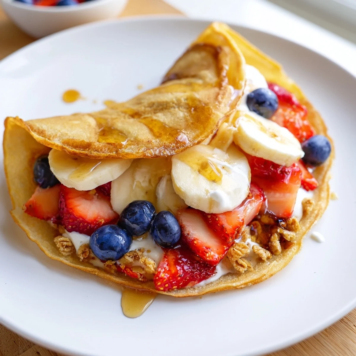 Savory pancake tacos loaded with scrambled eggs, crumbled bacon, and melted cheddar cheese