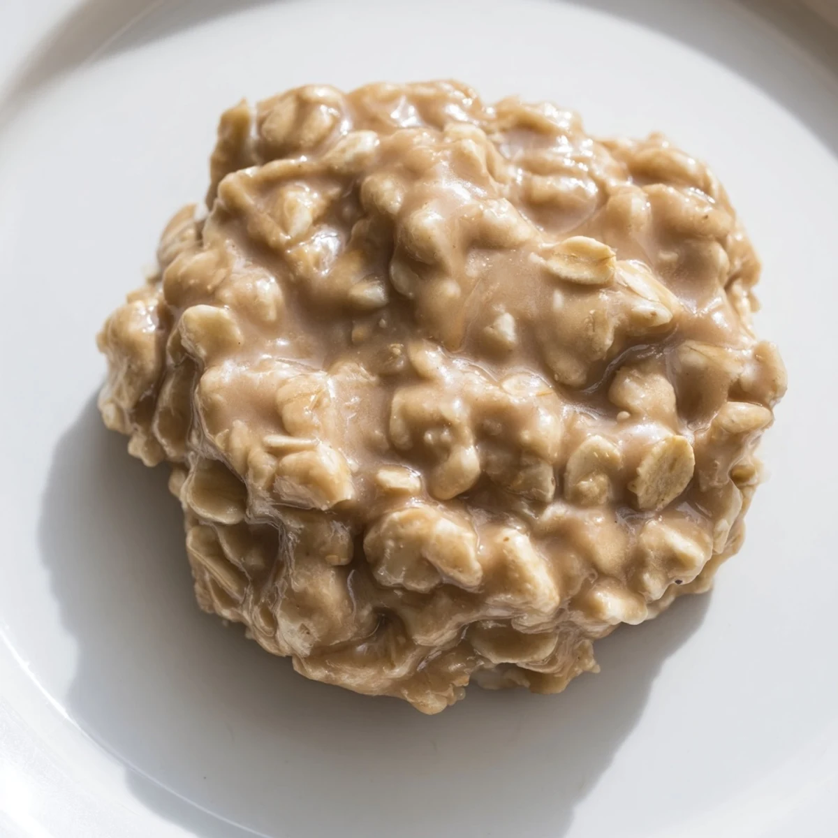 Close-up of soft peanut butter no bake cookies topped with oats ready to serve.
