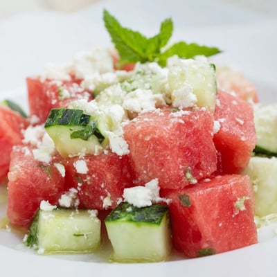 Juicy watermelon and crisp cucumber salad tossed in a tangy lime dressing.  